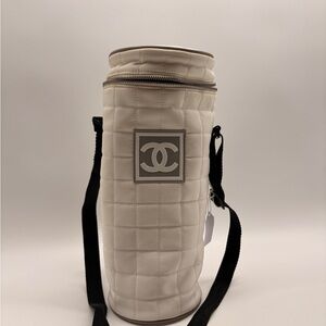 CHANEL Cream Quilted Cylinder Bottle Carrier with Black Strap